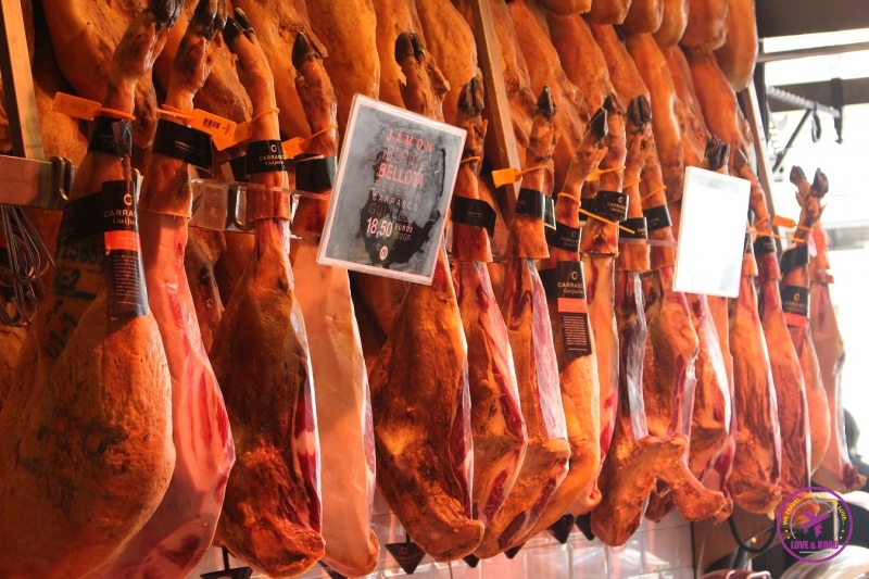 Famous Spanish food Jamón hanging from the ceiling.