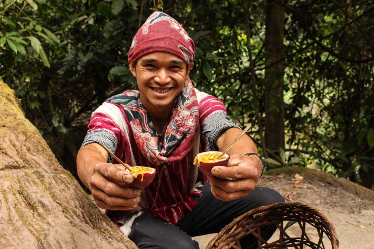 Guide serving passion fruit on expedition to the Chiang Mai mountains.