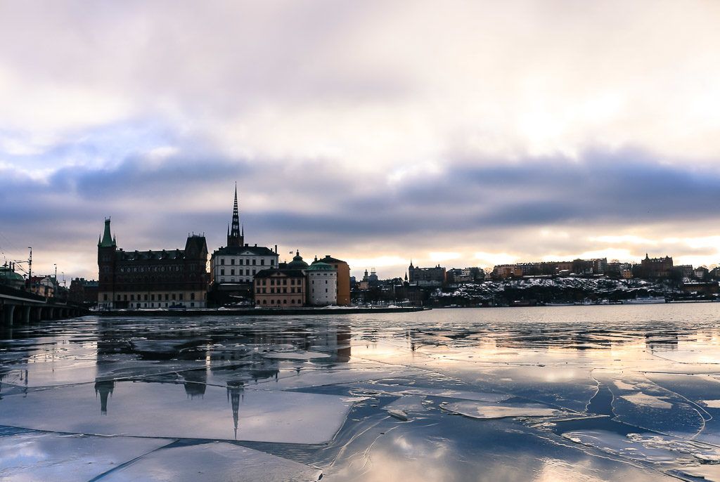 Photo of a frozen river in Stockholm, Sweden. The city is made of many islands and is one of the top places to visit in Scandinavia.