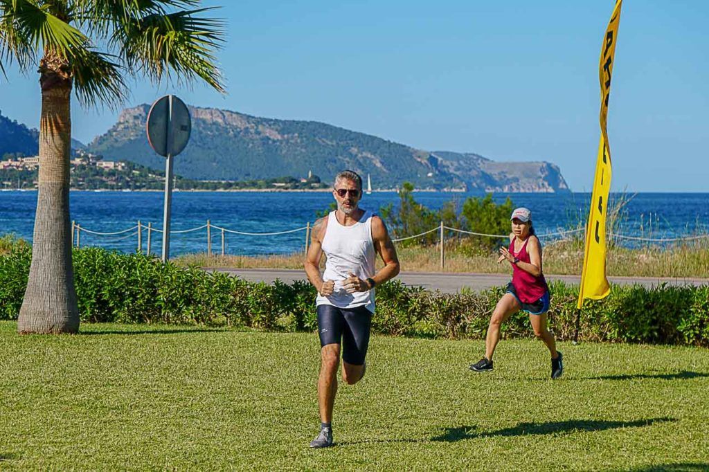 Man and woman running at bootcamp in Spain