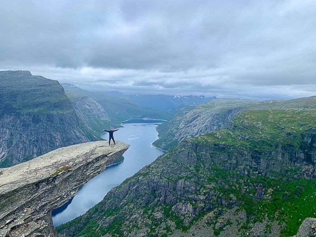 A view of Trolltunga. Here you will find all the information you need for the best road trip in Norway, including costs and tips to save money.