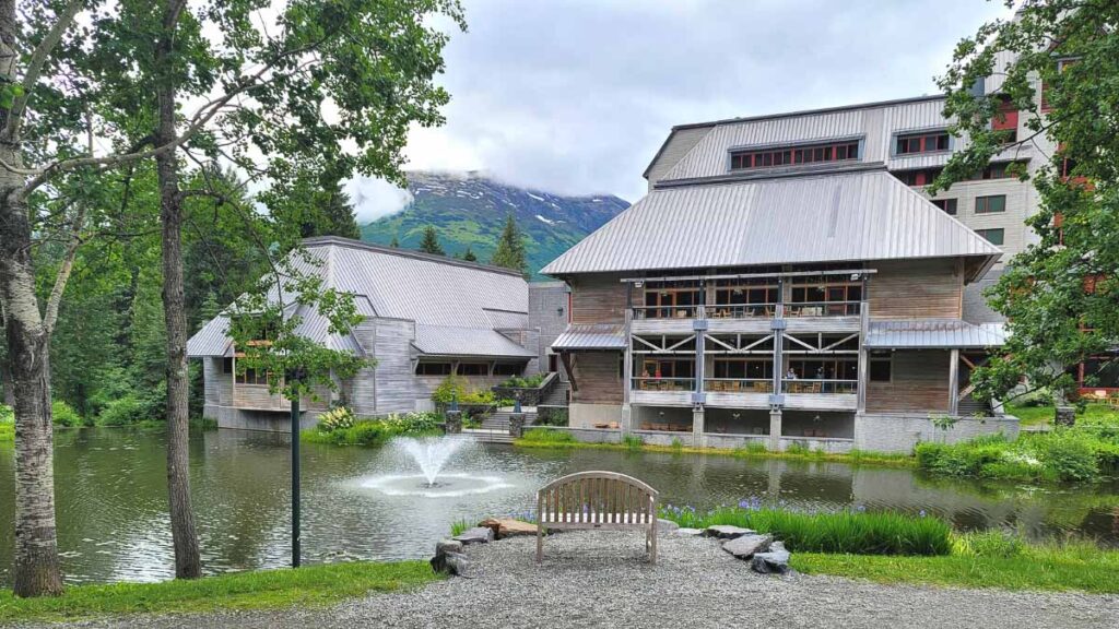 Photo of Alyeska Resort and Spa facade. Shows the building and a lake in front of it.