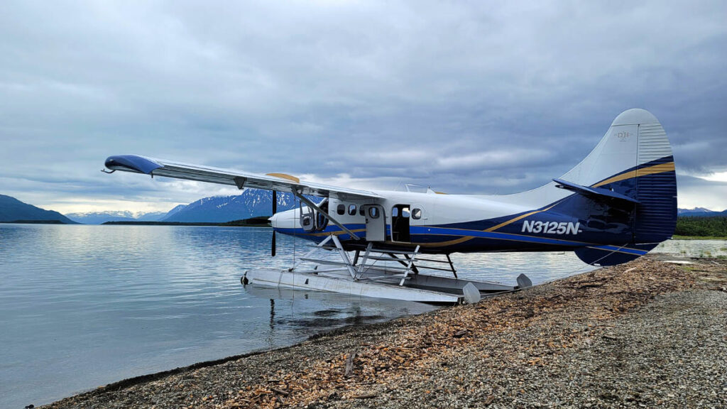 Photo of a hydroplane on the shore of a river in Alaska.