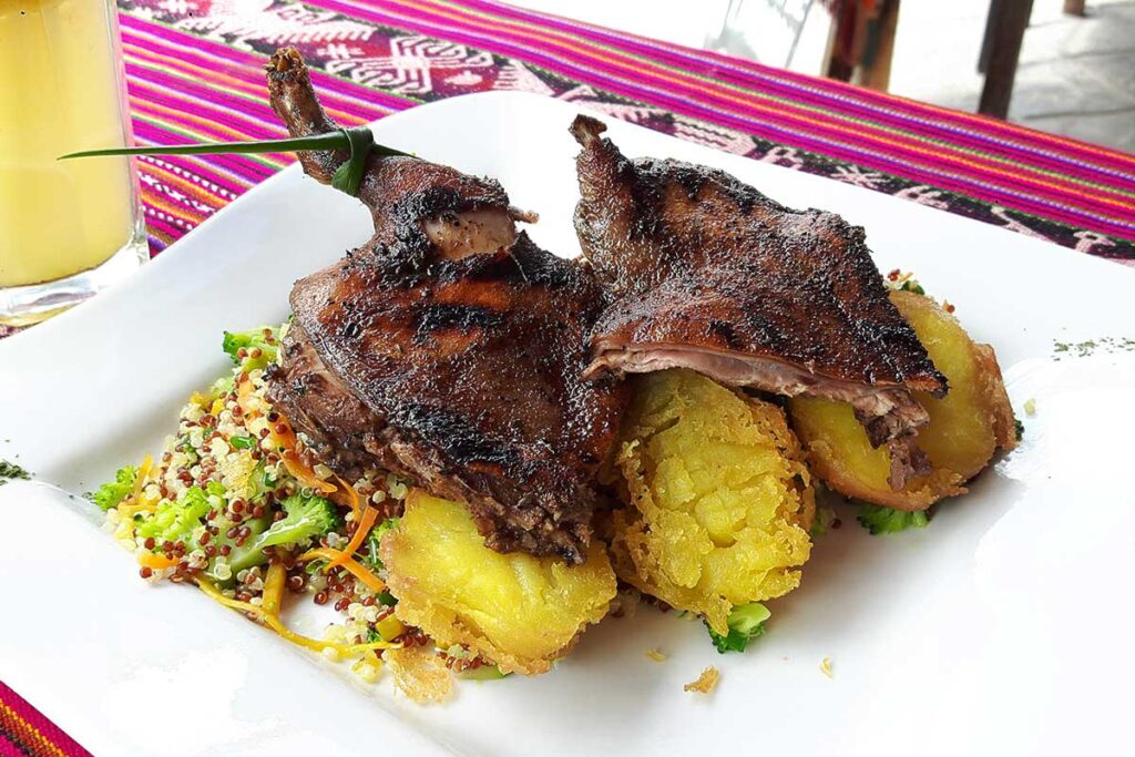 Peru is famous for its cuisine. One of the popular dishes in Cuy, a roasted guinea pig. The photo shows the cuy served with potatoes. 