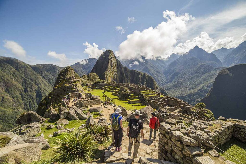 Photo of a group of people hiking to Machu Picchu, the lost city in Peru. One of the most famous attractions in Peru.