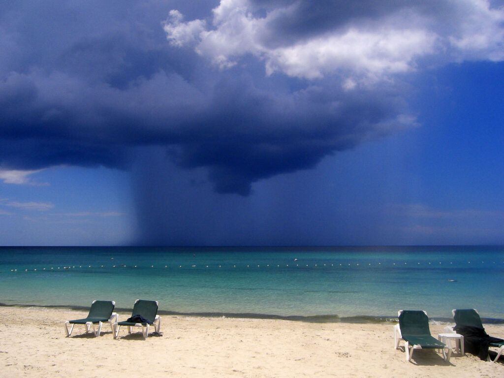 Tropical rain over the sea in Jamaica. September to November is the rainy season in the country. 