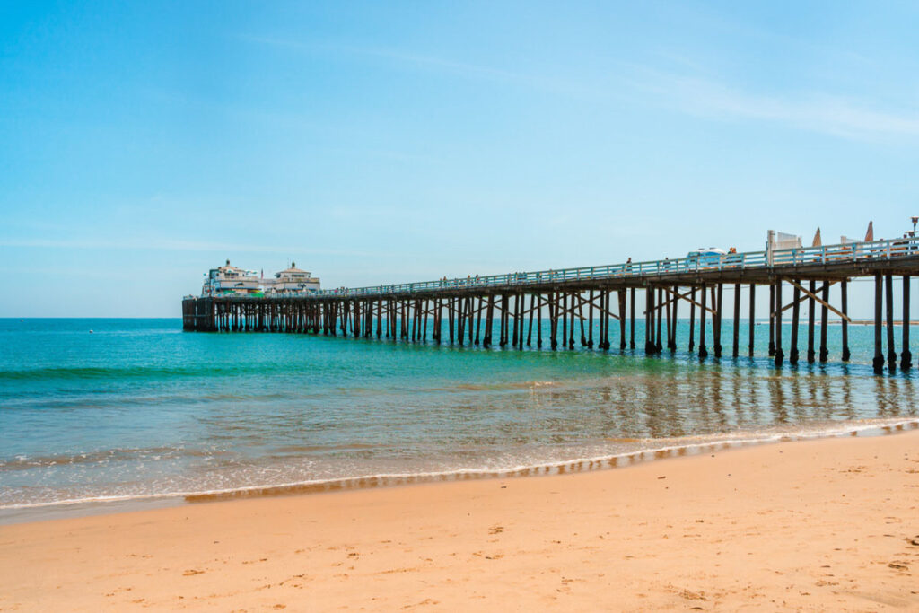 Another must thing to do in Malibu Beach is visiting its pier. Postcard view, blue sky, and beautiful ocean waves.