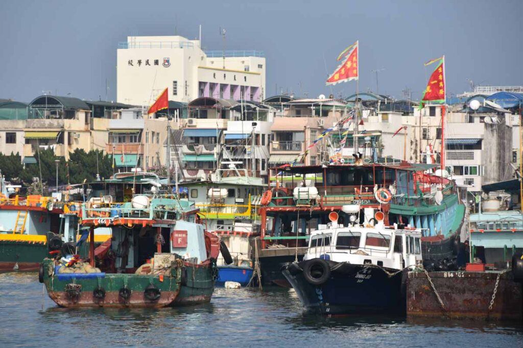Cheung Chau is a picturesque fishing village with many boats on the waterfront.
