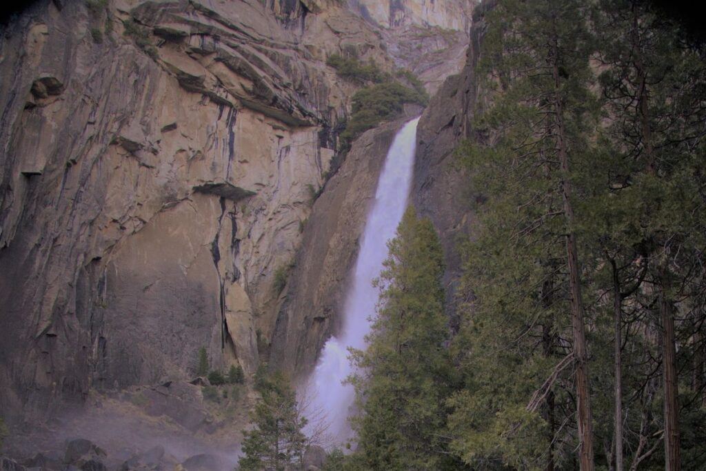 Photo of the Lower Yosemite Falls taken from a hiking trail in Northern California.