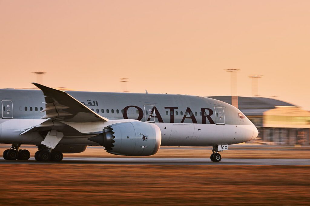 Qatar airplane on the airport runway.