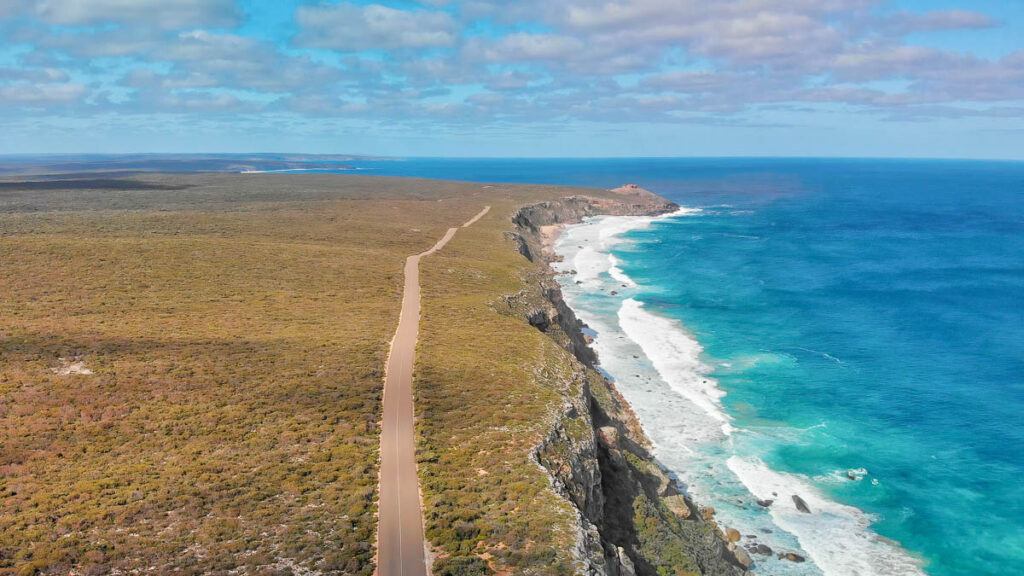 Flinders Chase National Park in Kangaroo Island. Amazing aerial view of road and coastline from a drone on a sunny day. One of the best road trips in Australia.