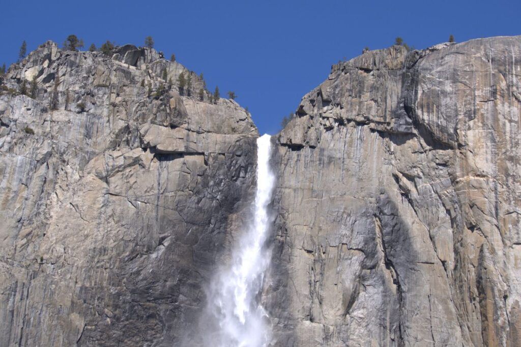 A photo of a waterfall in Yosemite National Park. The park is one of the popular day trips from Fresno in California.