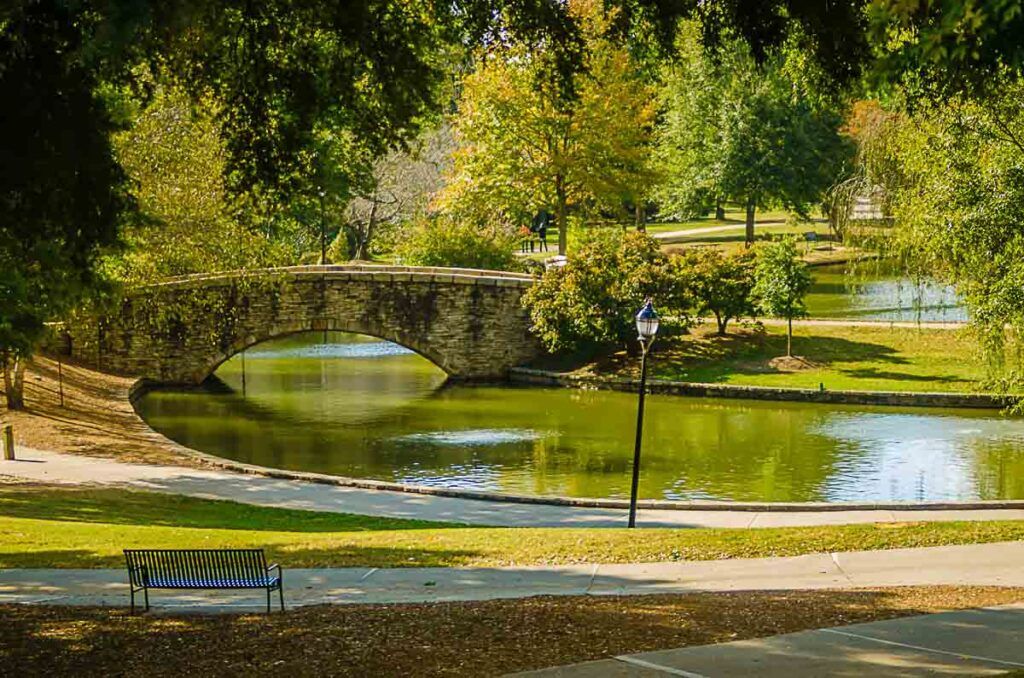 Flagstone walking bridge at Freedom Park in Charlotte, North Carolina. An outdoor place to visit in Charlotte.