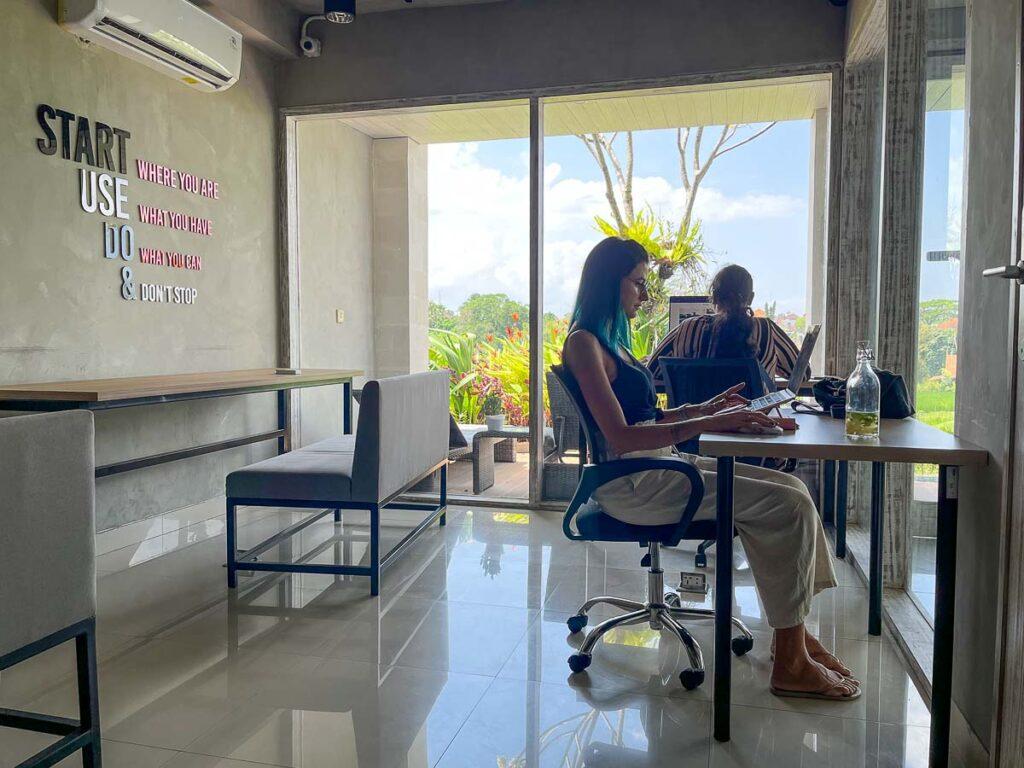 Nat and another girl working at Shashvata Coworking space in Canggu, Bali. It has rice fields views.
