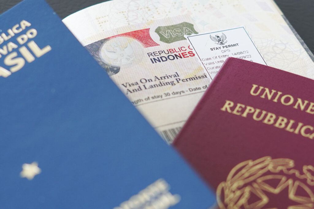Photo of passports and Indonesia Visa. There are many types of visas that you can apply for to live as a digital nomad in Bali.