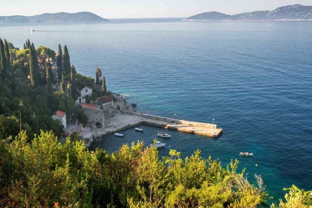 Adriatic coast with the sunny harbor in Trsteno, Dalmatia, Croatia. Tourist attraction near Dubrovnik. It's still a hidden gem in Croatia.
