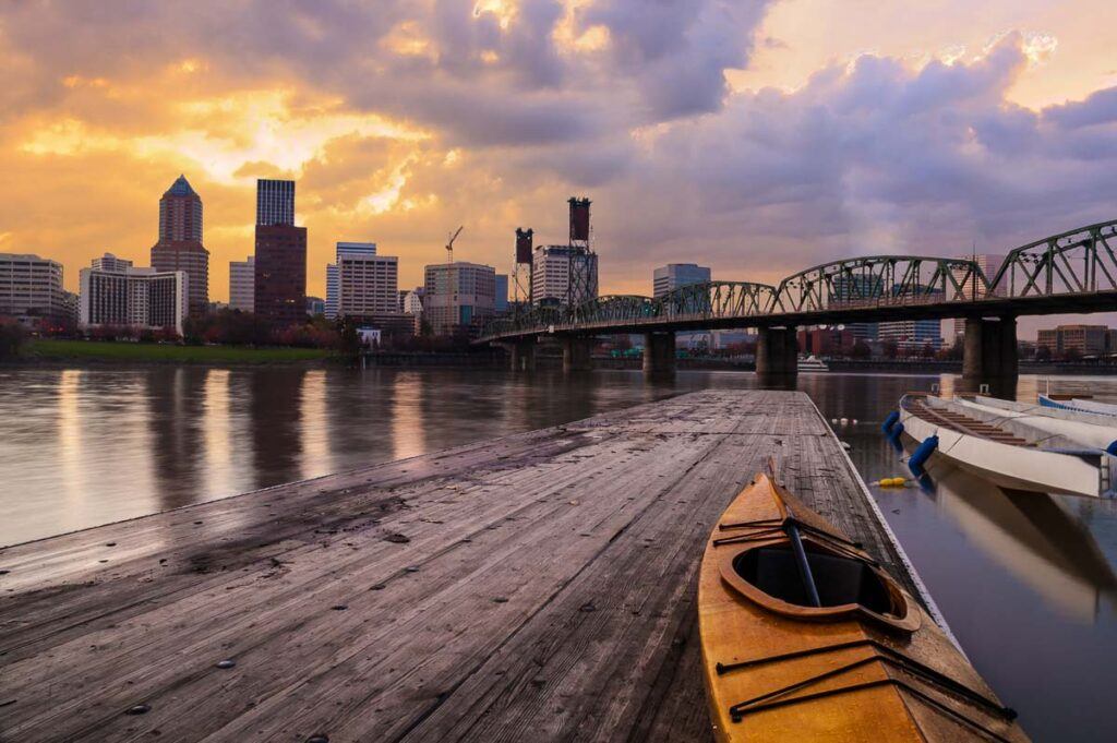 Portland, Oregon Panorama. Sunset scene with dramatic sky and light reflections on the Willamette River. One of the places to visit in Portland, OR.