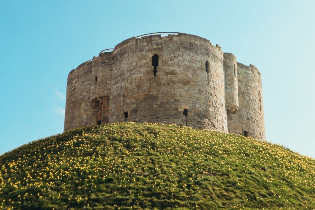 Clifford's Tower is an imposing stone building perched high on a mound that overlooks the city. It's one of York's famous landmarks.
