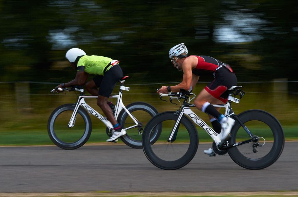 Triathletes riding bikes at the Hamburg Ironman competition in Germany. 