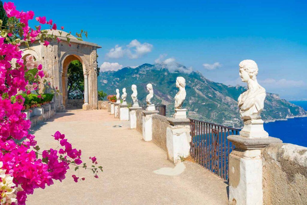 Beautiful details of Ravello village with flowers and statues on the Amalfi Coast.
