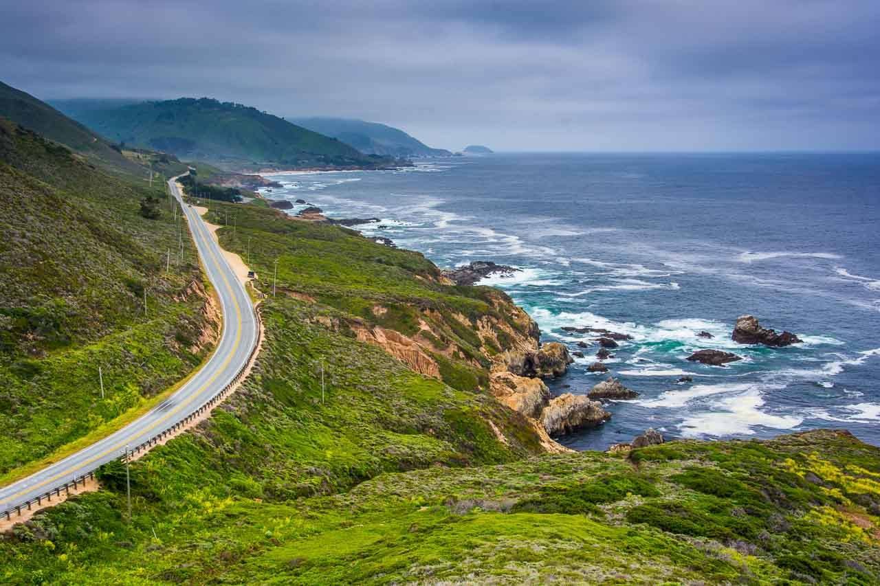 View of Pacific Coast Highway in Northern California. Shows the road between the mountains and the sea.