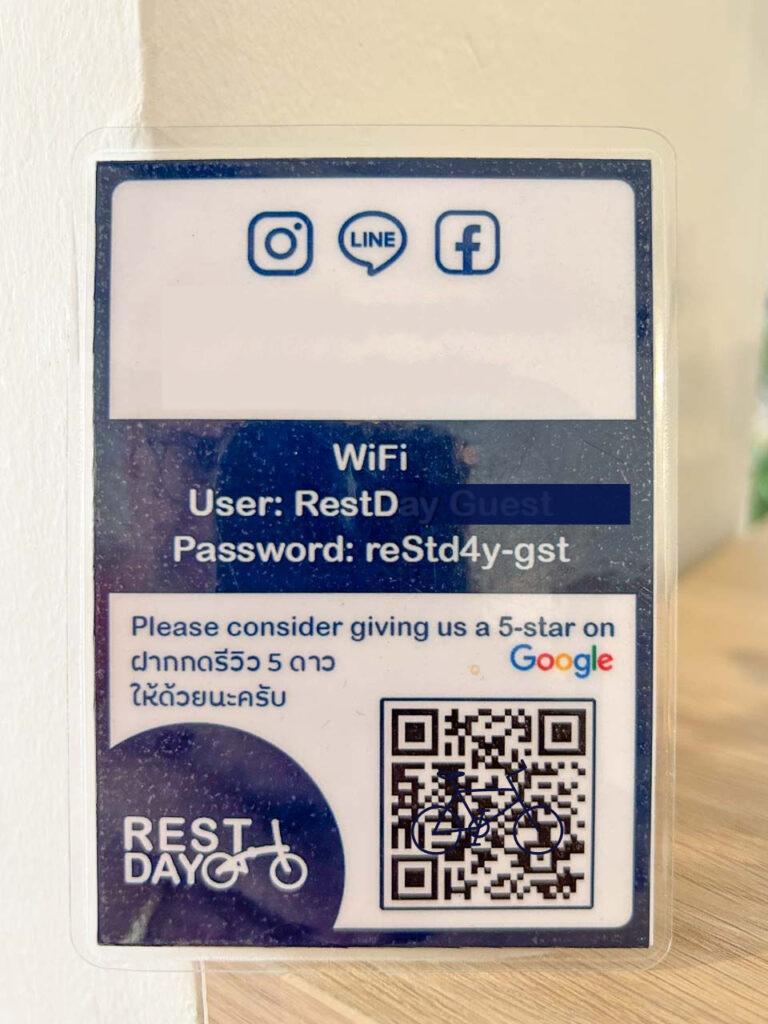 A card in a restaurant in Thailand showing a QR code for customers' reviews.