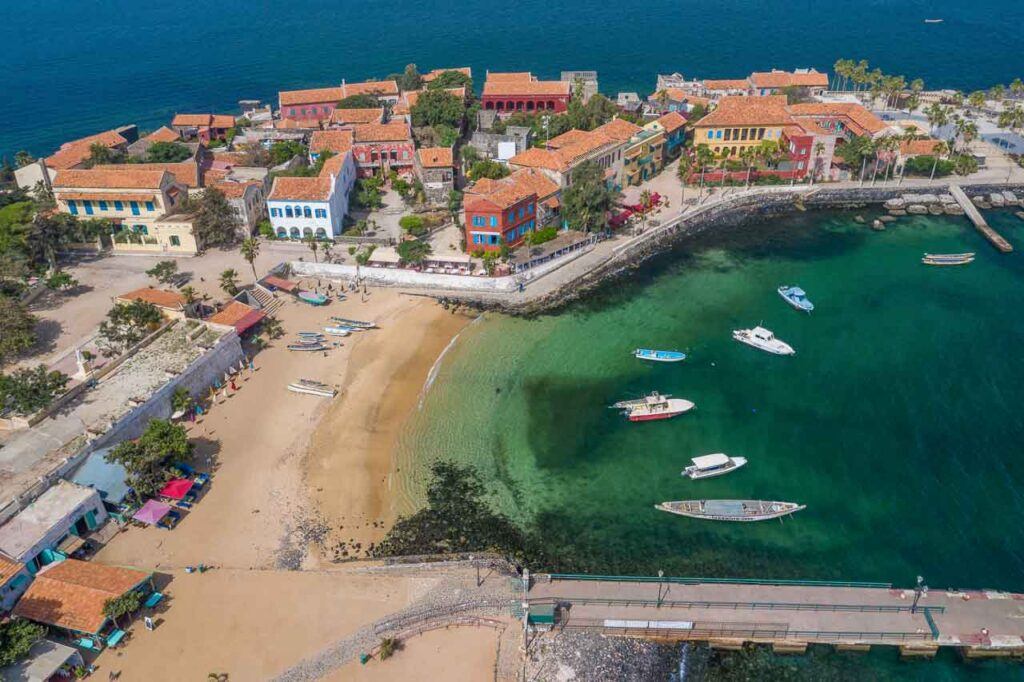 Aerial view of Goree Island with boats floating on blue water in Dakar, Senegal, Africa