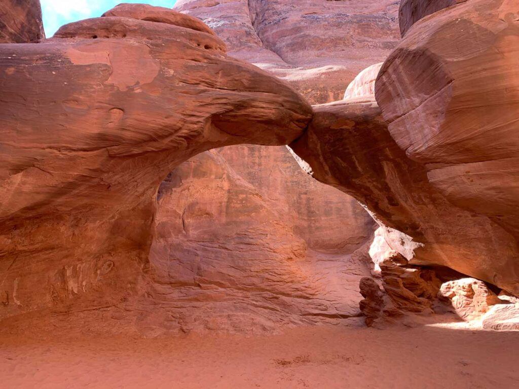 Photo of the Sand Dune Arch, located inside a canyon in Arches National Park. It is one of the best hikes in the park. 