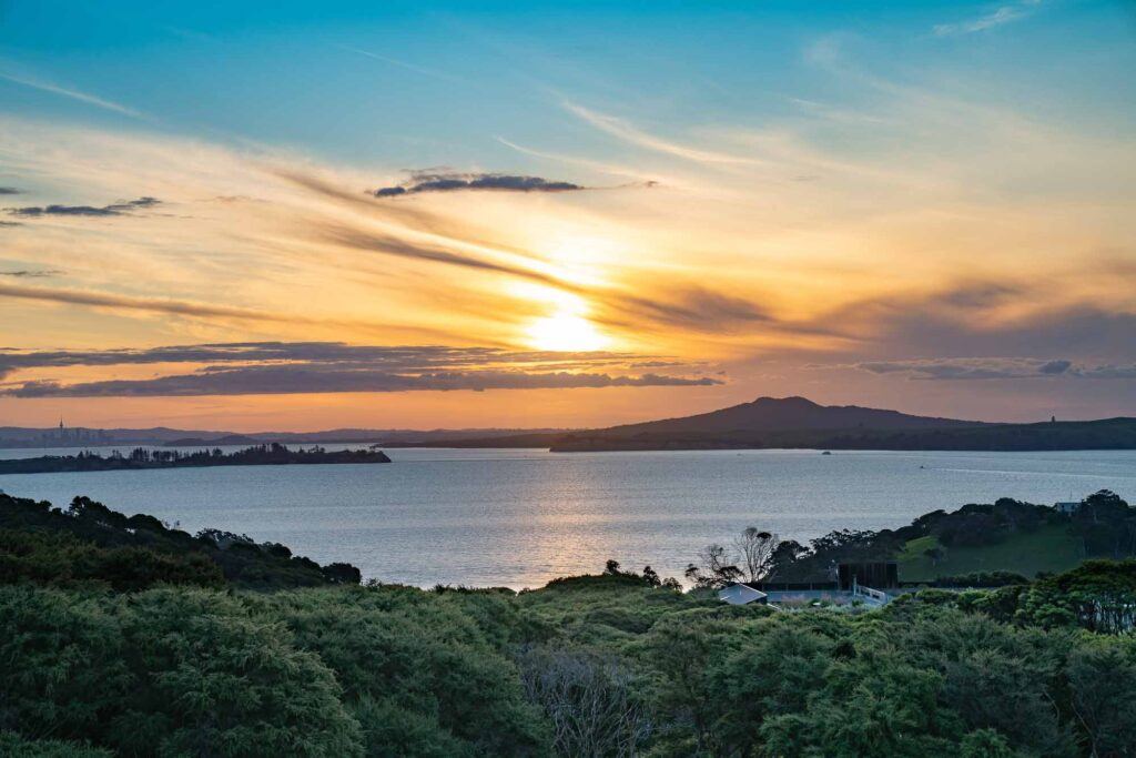Sunset view from Waiheke Island to Rangitoto Island, Auckland New Zealand.
