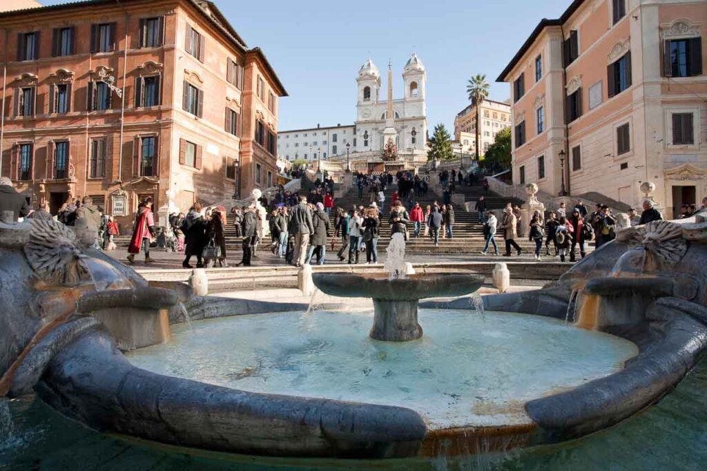 Photo of the Spanish Steps in Rome with a crowd of tourists visiting it. It's a must-see place when you plan to visit Rome in 2 days.